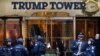 FILE - Members of the New York Police Department's counterterrorism unit guard Trump Tower, in New York City, Nov. 14, 2016. President Trump has alleged that his offices in the building were wiretapped last year on order of President Barack Obama.