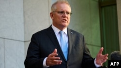 FILE - Australian Prime Minister Scott Morrison speaks during a press conference at Parliament House in Canberra, Aug. 17, 2021. 