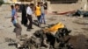 Citizens inspect the site of a car bomb attack in the capital's eastern Mashtal neighborhood, Iraq, Oct. 27, 2013.